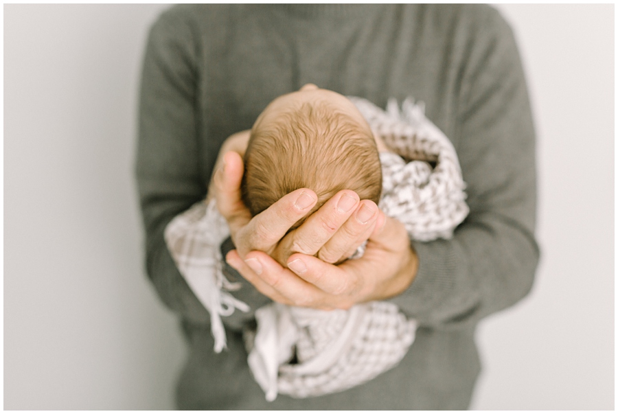 katie ballantine photography, Frederick Maryland Baby and Child Photographer, New Market Maryland Baby Photographer, New Market Maryland Child Photographer, Frederick Maryland family photographer, Frederick Maryland all white studio, baby in white studio photography, frederick newborn photographer, new market maryland newborn photographer, natural posing newborn photography, father holding newborn photograph