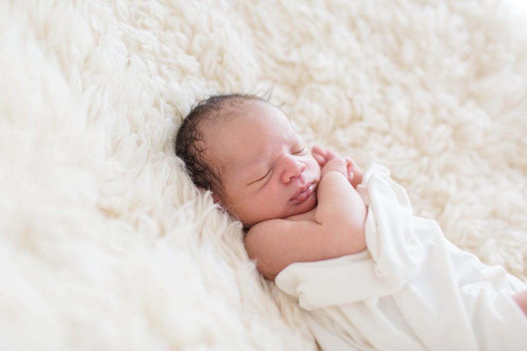 sleeping baby on flokati.  all natural newborn photography.  organic newborn photography.  katie ballantine photography.  new market frederick maryland newborn photographer