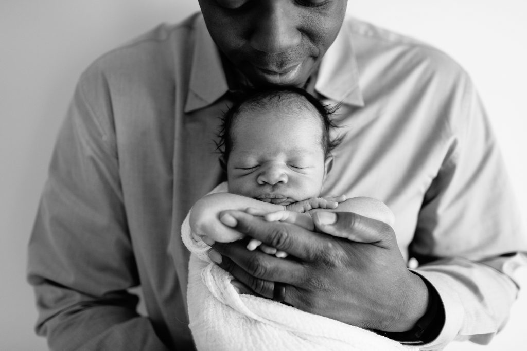 Daddy holding new baby.  Katie ballantine Photography.  New Market Frederick Maryland Newborn Photographer