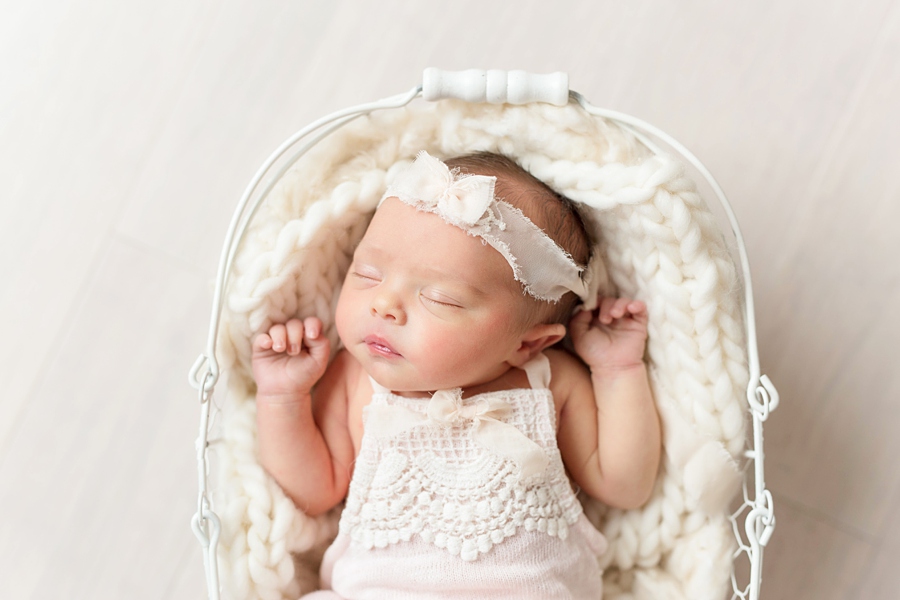 Katie Ballantine Photography Frederick Newborn Photographer.  New Market newborn photography.  Baby girl in a white antique basket.  