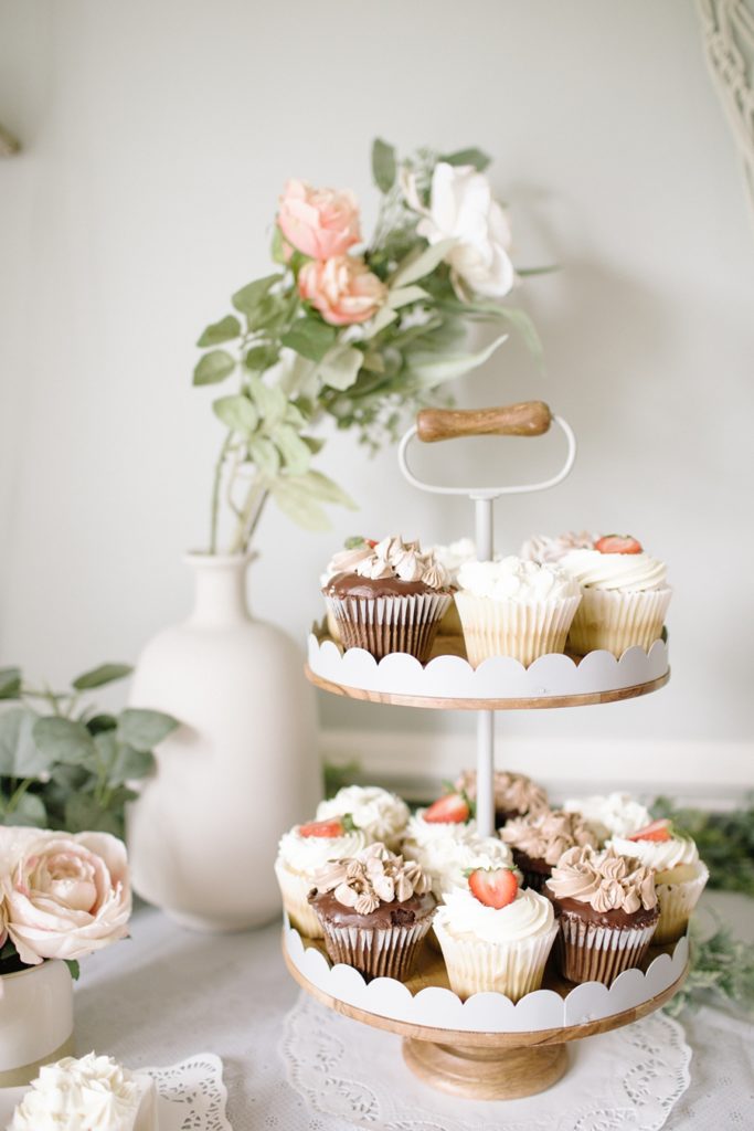 Frederick Maryland Baby Photographer. New Market photographer. Katie Ballantine Photography.  In home cake smash.  One year old eating cake. cupcakes.