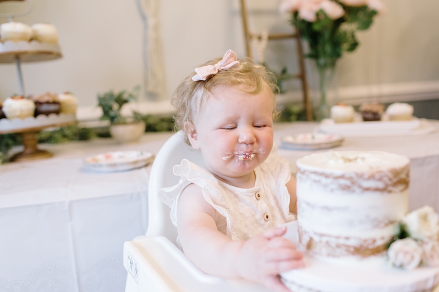 Frederick Maryland Baby Photographer. New Market photographer. Katie Ballantine Photography.  In home cake smash.  One year old eating cake