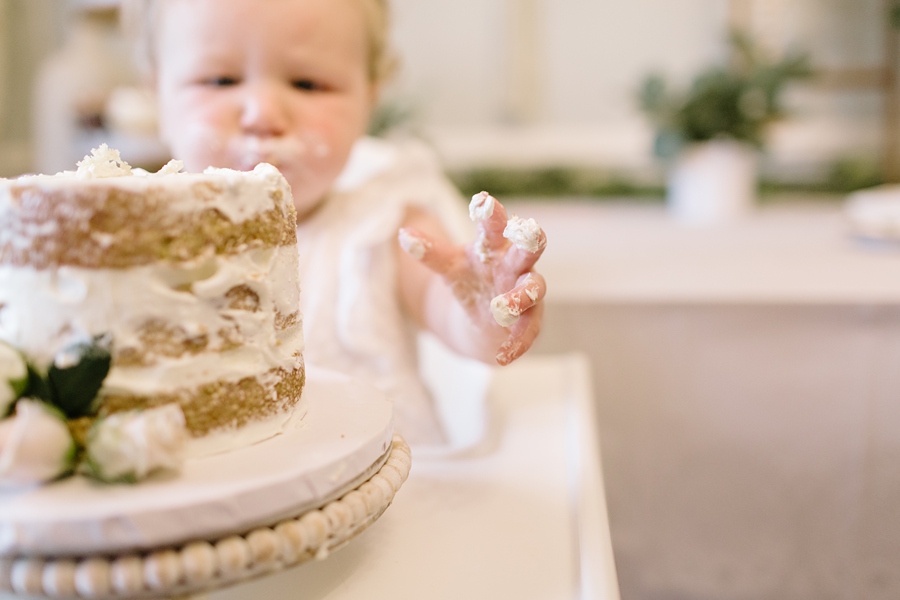 Frederick Maryland Baby Photographer. New Market photographer. Katie Ballantine Photography.  In home cake smash.  One year old eating cake