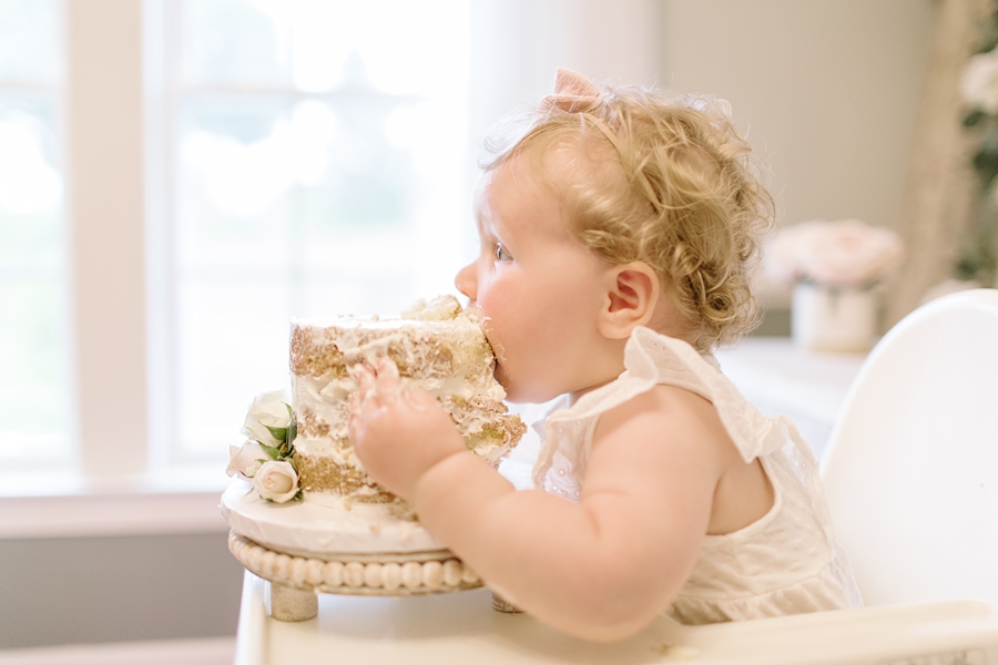 Frederick Maryland Baby Photographer. New Market photographer. Katie Ballantine Photography.  In home cake smash.  One year old eating cake