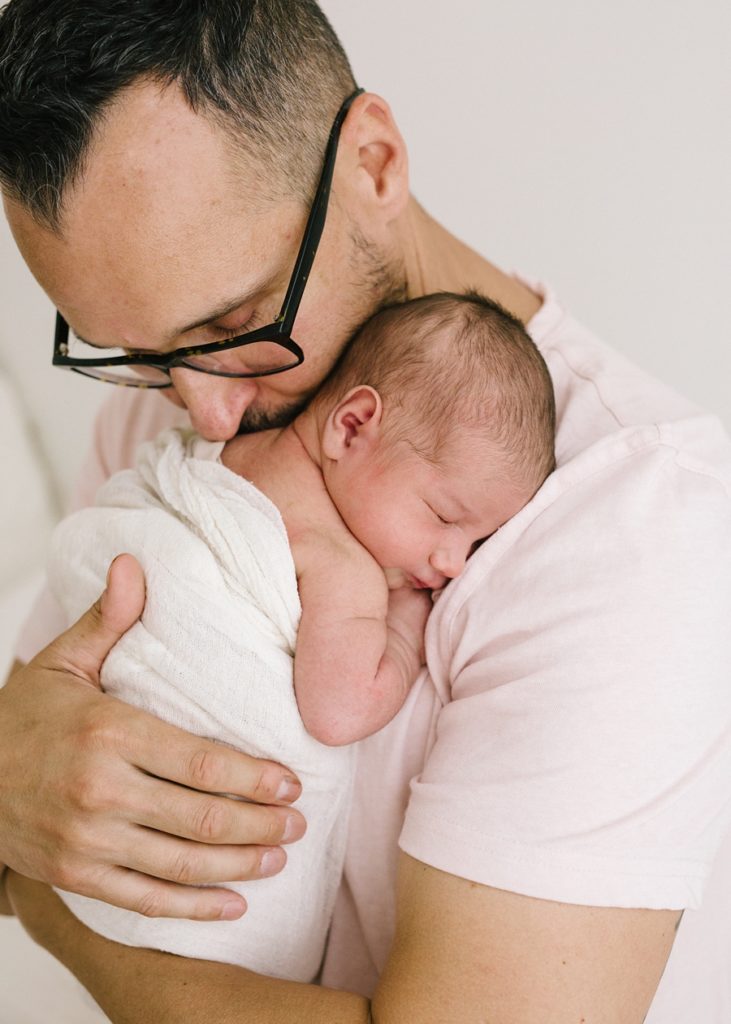 Katie Ballantine Photography, Frederick Maryland Newborn Photographer, dad and newborn image, dad holding baby, all white studio, organic newborn portraiture