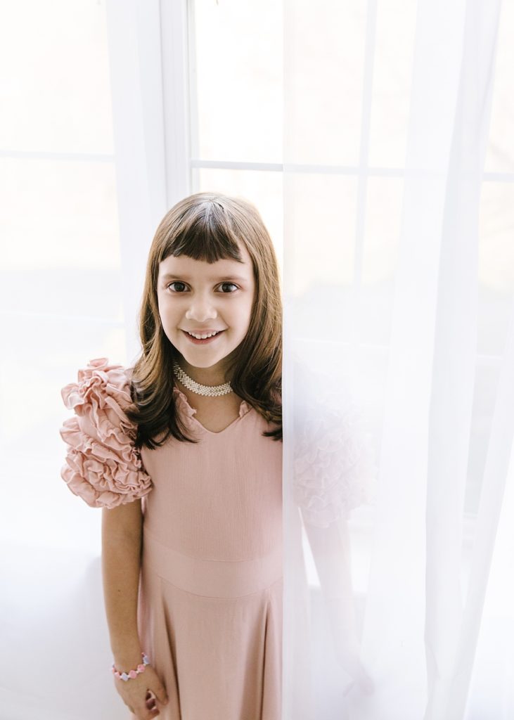 Katie Ballantine Photography.  Frederick Maryland Child Photographer.  New Market, Maryland Studio Child Photographer.  Girl in pink dress 