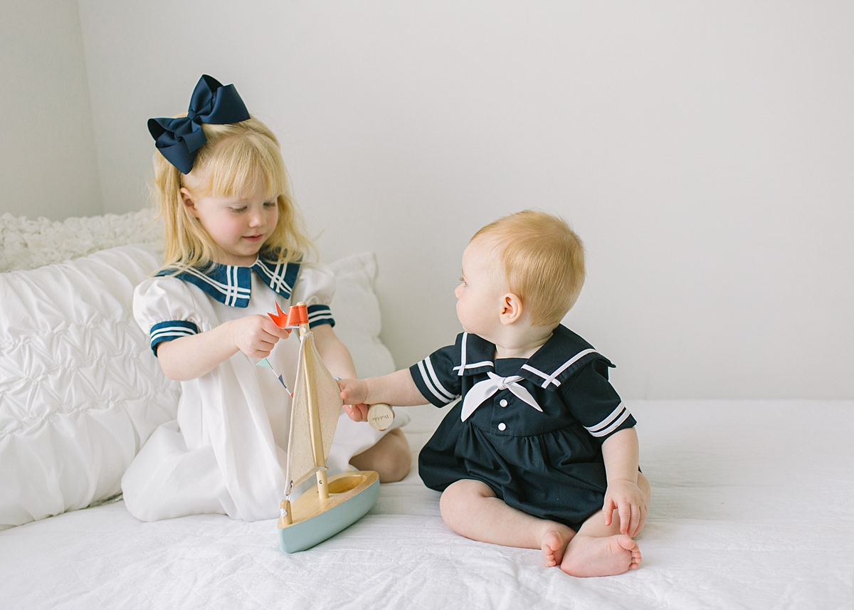 Katie Ballantine Photography. New Market Baby and child Photographer. Organic baby photography Frederick Maryland. Frederick Maryland child studio portraits. Baby sailor outfits. 6 month old sitting up session.